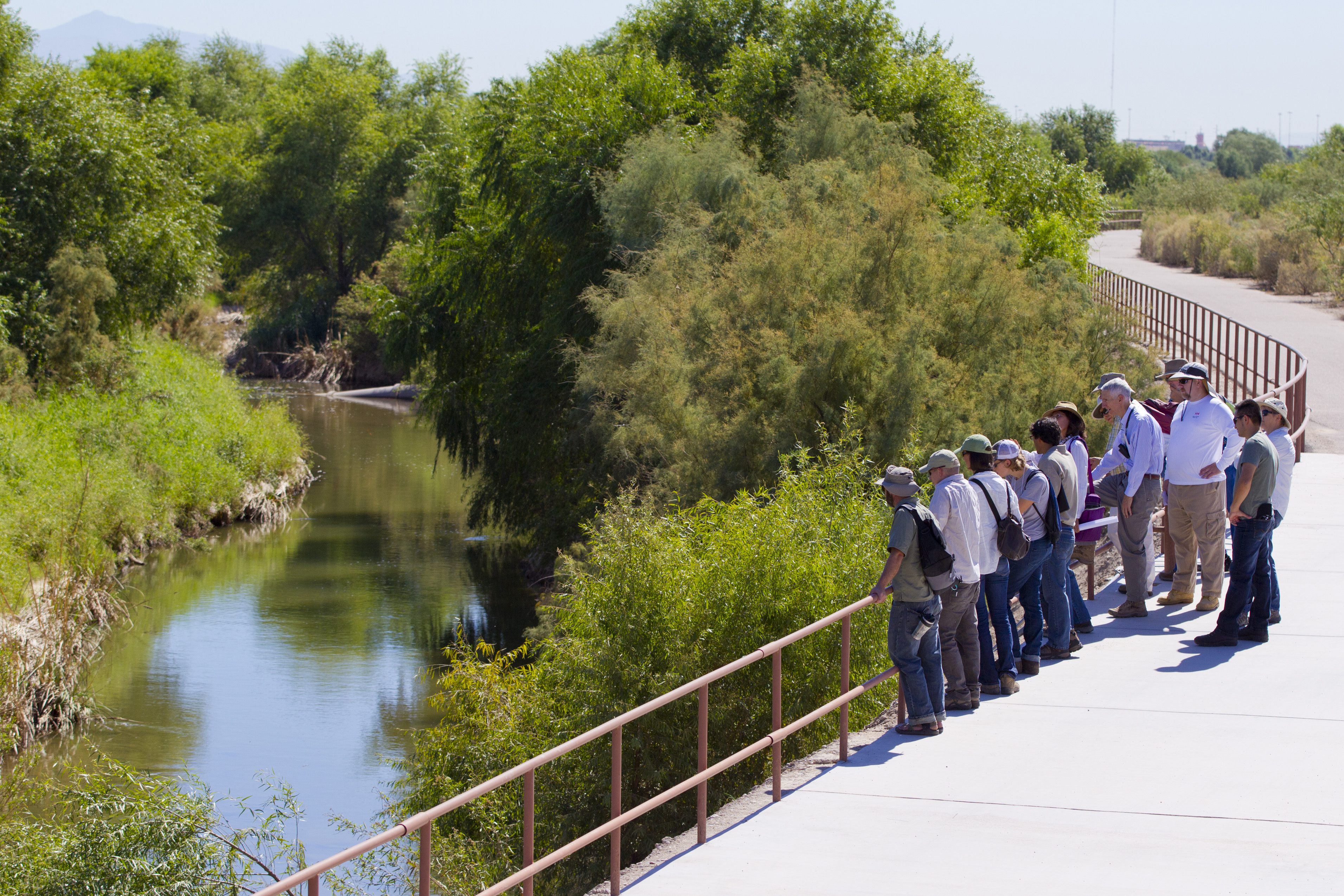 Photo of a tour by the Arizona Riparian Council of a visit to the Santa Cruz River near Cortaro Farms Road on October 3, 2014. The tour was part of the Living River Project.