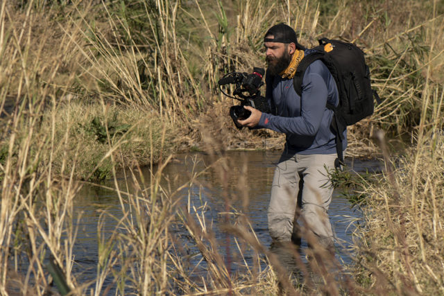 Andrew Quinn filming in Santa Cruz River, AZ